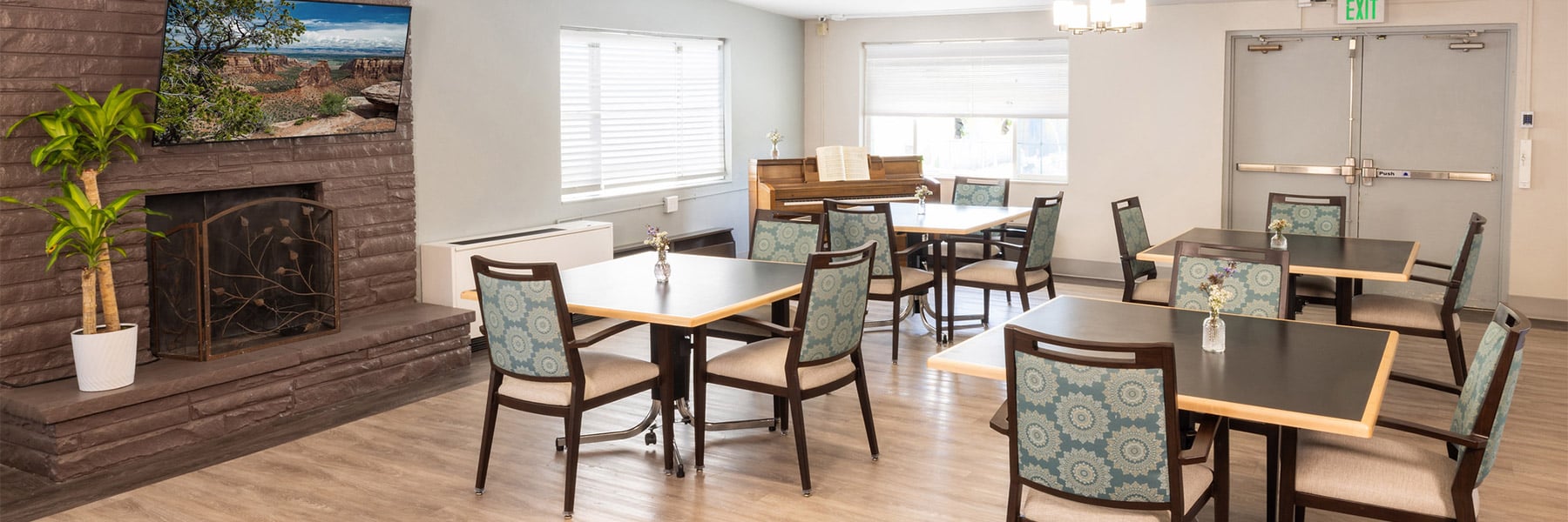 Dining room with fireplace at Eagle Ridge Post Acute