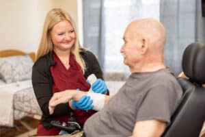 Nurse wrapping bandage on patient at Eagle Ridge Post Acute