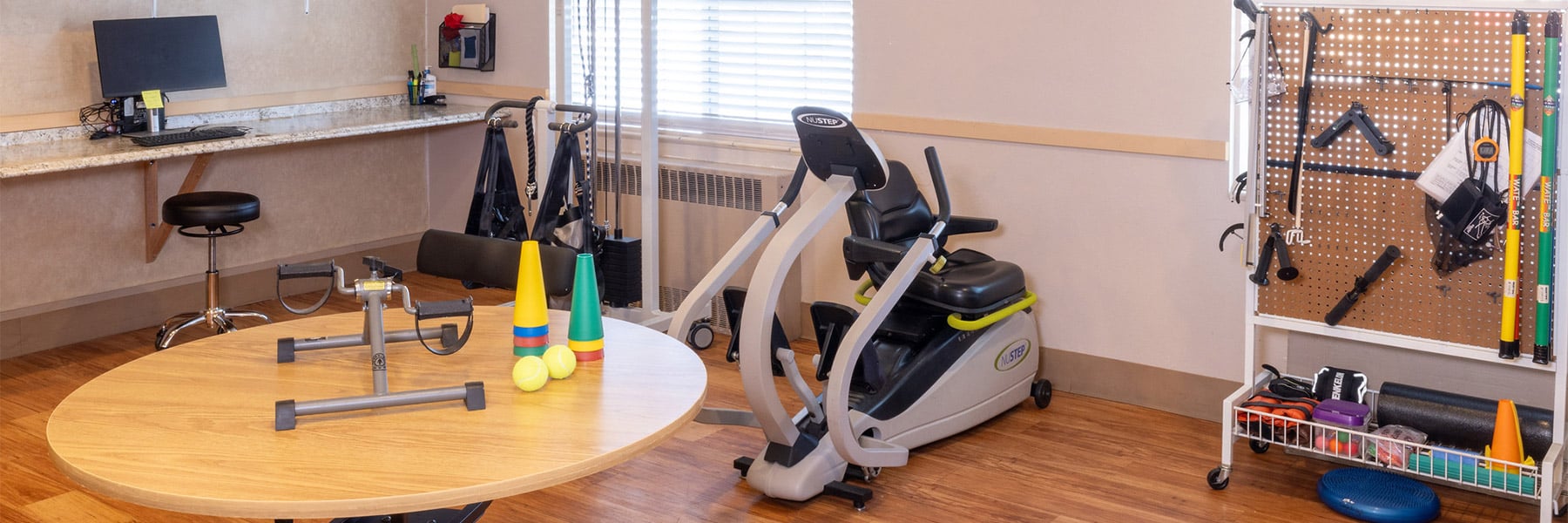 Rehab gym with bikes and OT tools at Eagle Ridge Post Acute